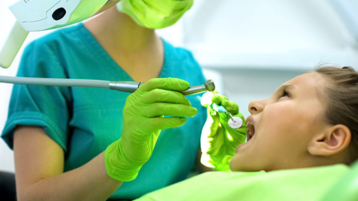 Little girl getting a dental cleaning at Yukon Kids Dental