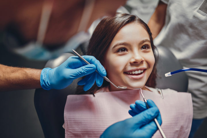 Girl having a dental checkup at Yukon Kids Dental