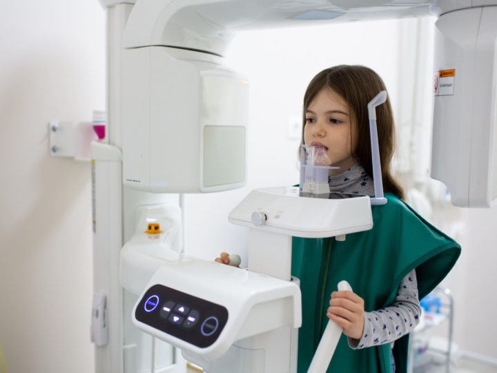 Girl getting Digital X-rays of her teeth at Yukon Kids Dental.